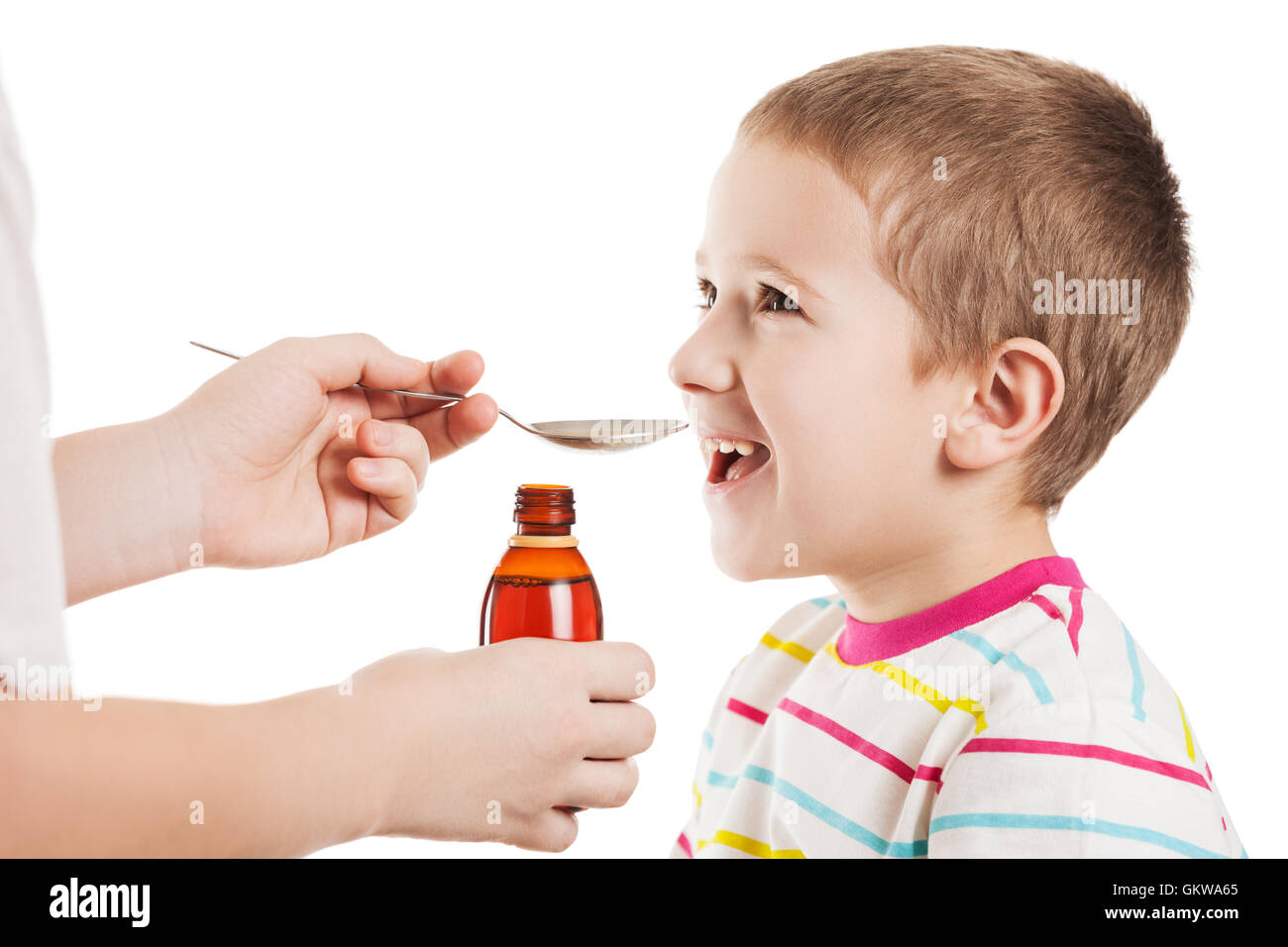 Doctor giving spoon of syrup to child boy Stock Photo Alamy