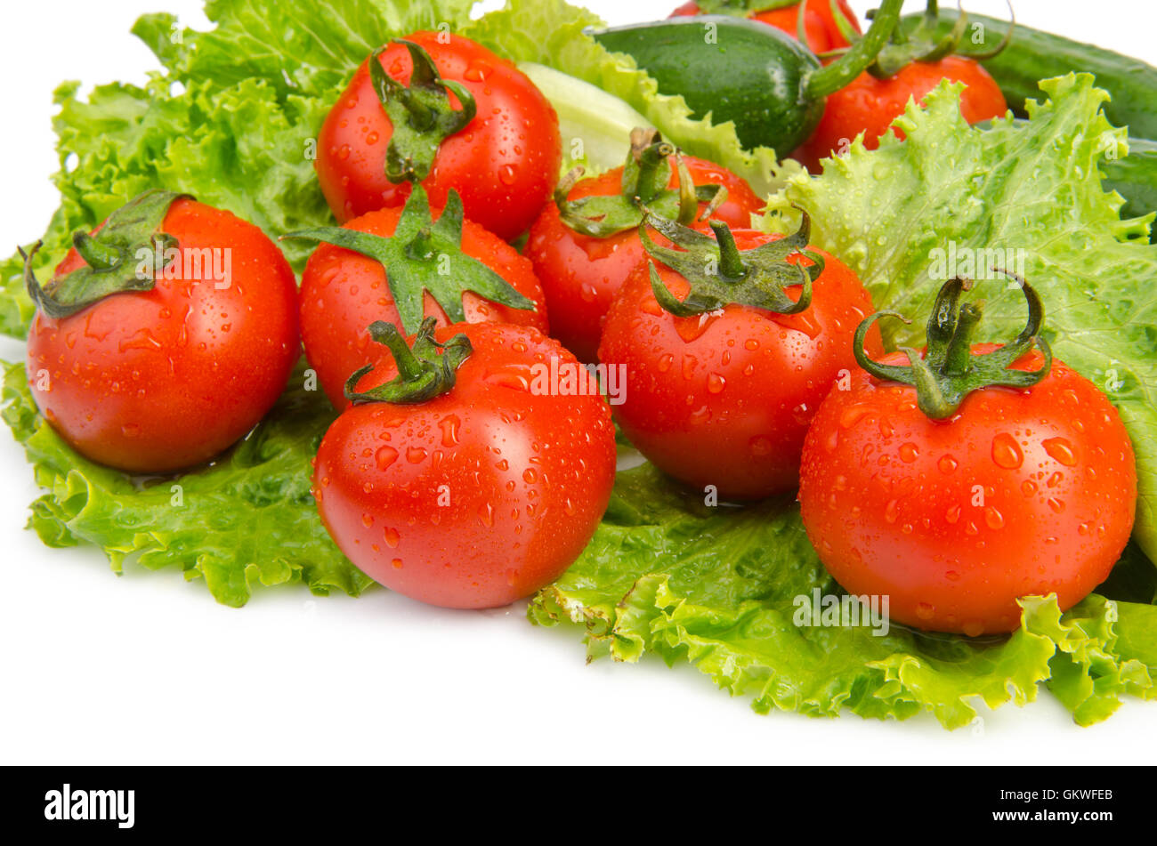 Cucumbers and tomatoes ready for salad Stock Photo - Alamy