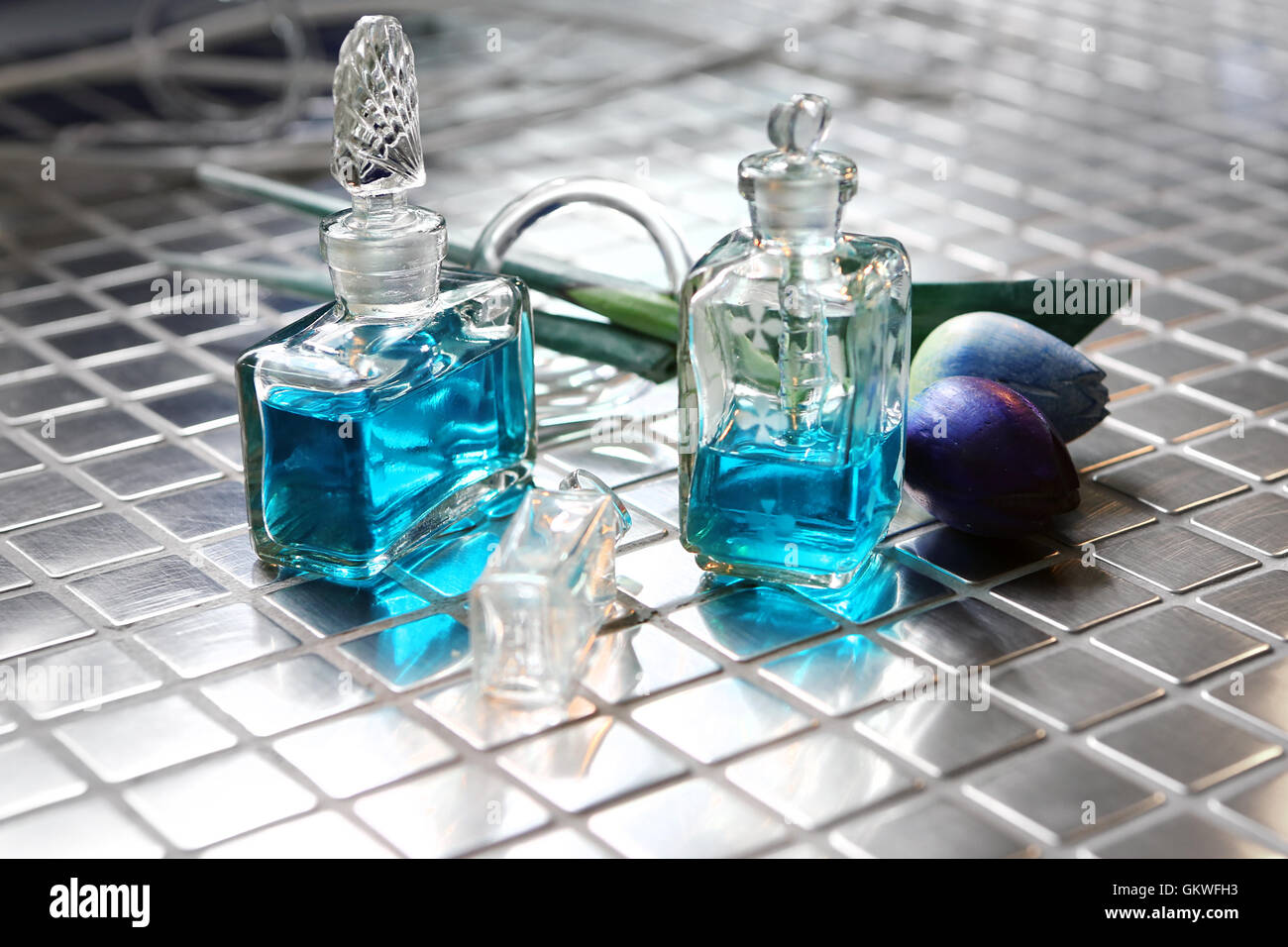 Perfume with beautiful flowers on the table Stock Photo