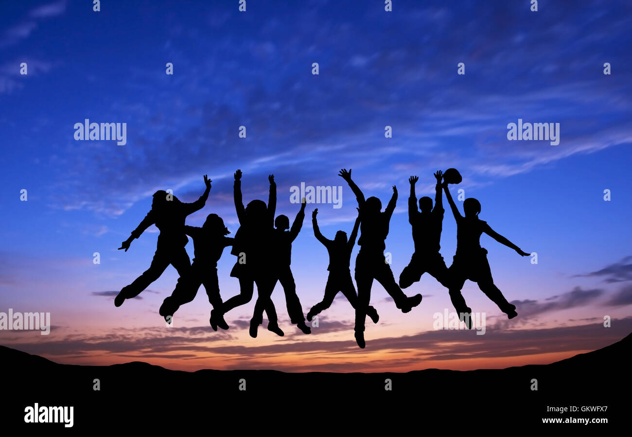 Crowd of friends jumping on blue sky background Stock Photo - Alamy
