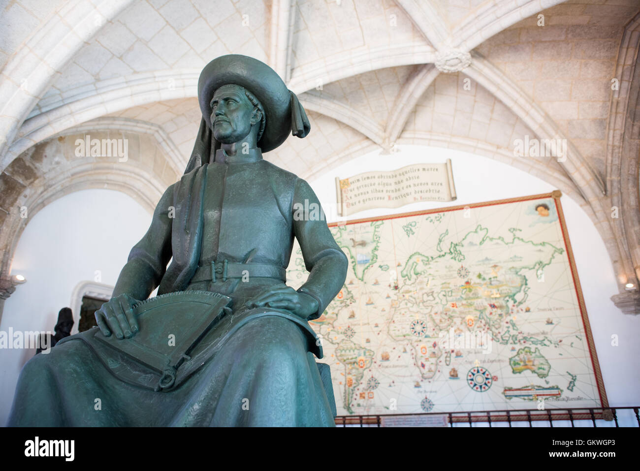 Henry The Navigator Statue Museu De Marinha Lisbon // LISBON, Portugal — A statue of Henry the Navigator (1394-1460) that stands inside the entrace to the Museu de Marinha (Maritime Museum) in Lisbon, Portugal. Behind the statue, against the wall, is a large map tracing the major voyages of Portugal's Age of Discovery. The Museu de Marinha (Maritime Museum of Navy Museum) focuses on Portuguese maritime history. It features exhibits on Portugal's Age of Discovery, the Portuguese Navy, commercial and recreational shipping, and, in a large annex, barges and seaplanes. Located in the Belem neighbo Stock Photo
