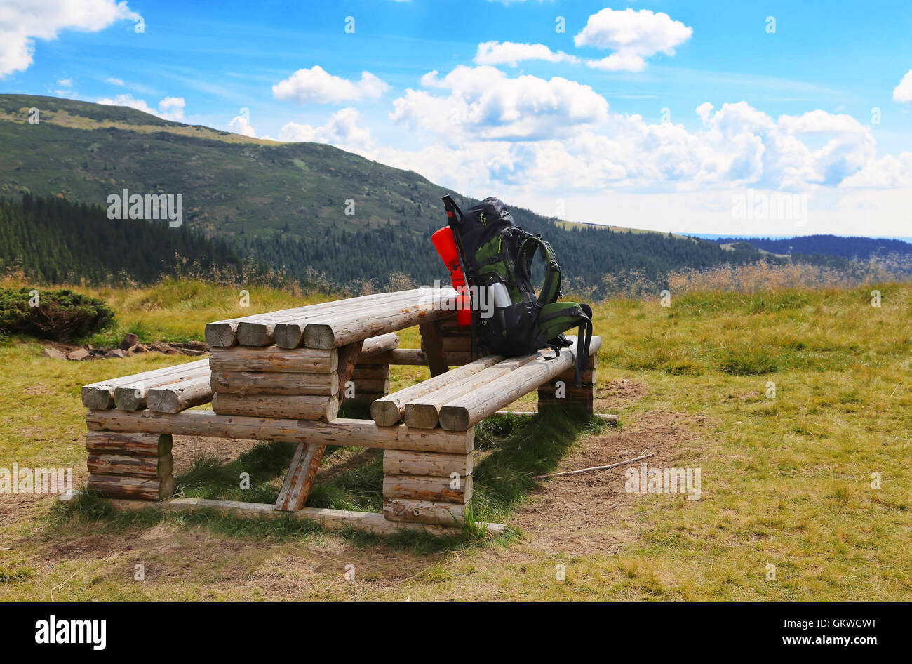 Mountain backpack hiker equipment on wooden camping table Stock Photo ...