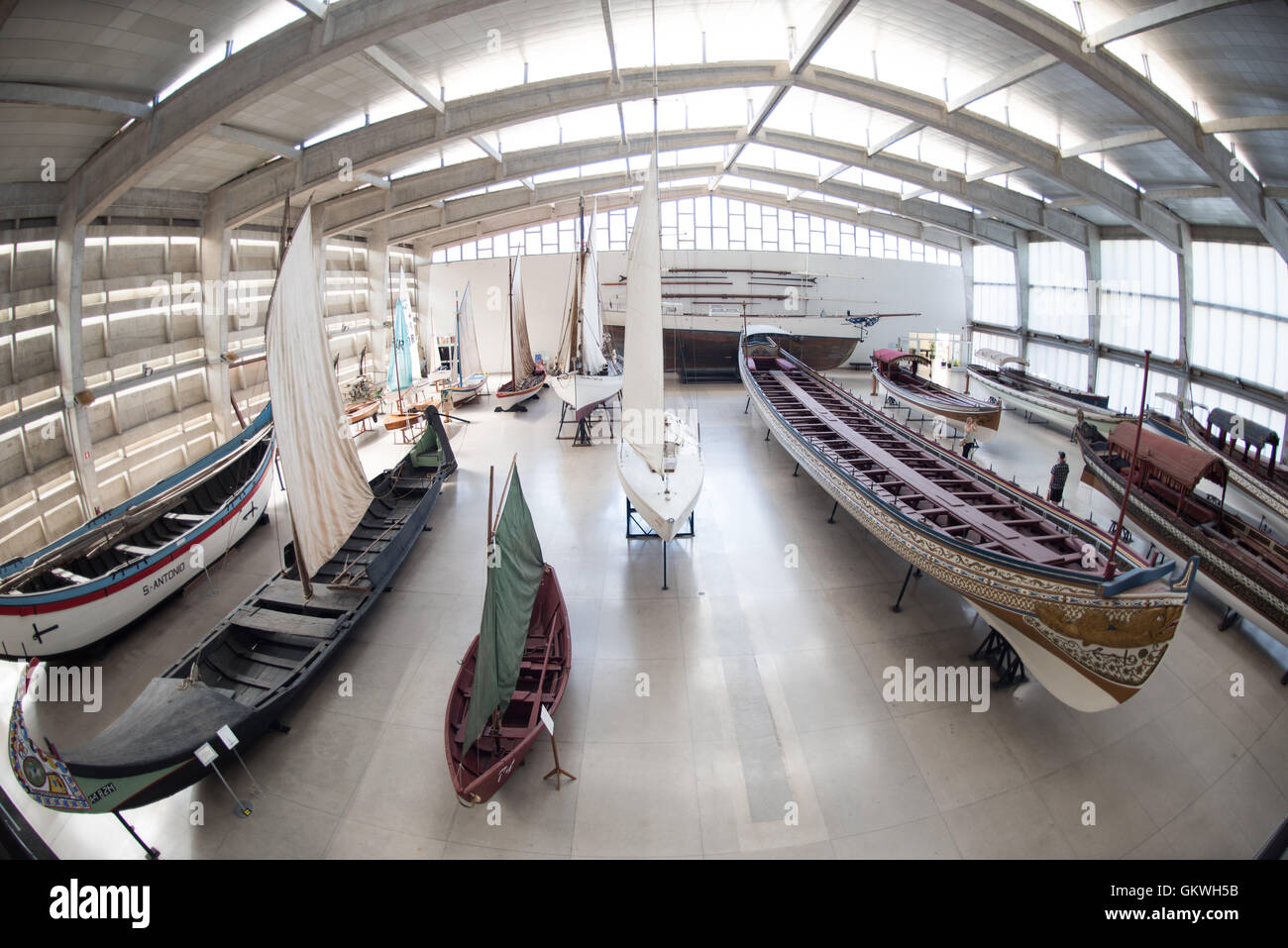 Museu De Marinha Boats Lisbon Portugal // LISBON, Portugal — The Museu de Marinha (Maritime Museum of Navy Museum) focuses on Portuguese maritime history. It features exhibits on Portugal's Age of Discovery, the Portuguese Navy, commercial and recreational shipping, and, in a large annex, barges and seaplanes. Located in the Belem neighborhood of Lisbon, it occupies, in part, one wing of the Jerónimos Monastery. Its entrance is through a chapel that Henry the Navigator had built as the place where departing voyagers took mass before setting sail. The museum has occupied its present space since Stock Photo