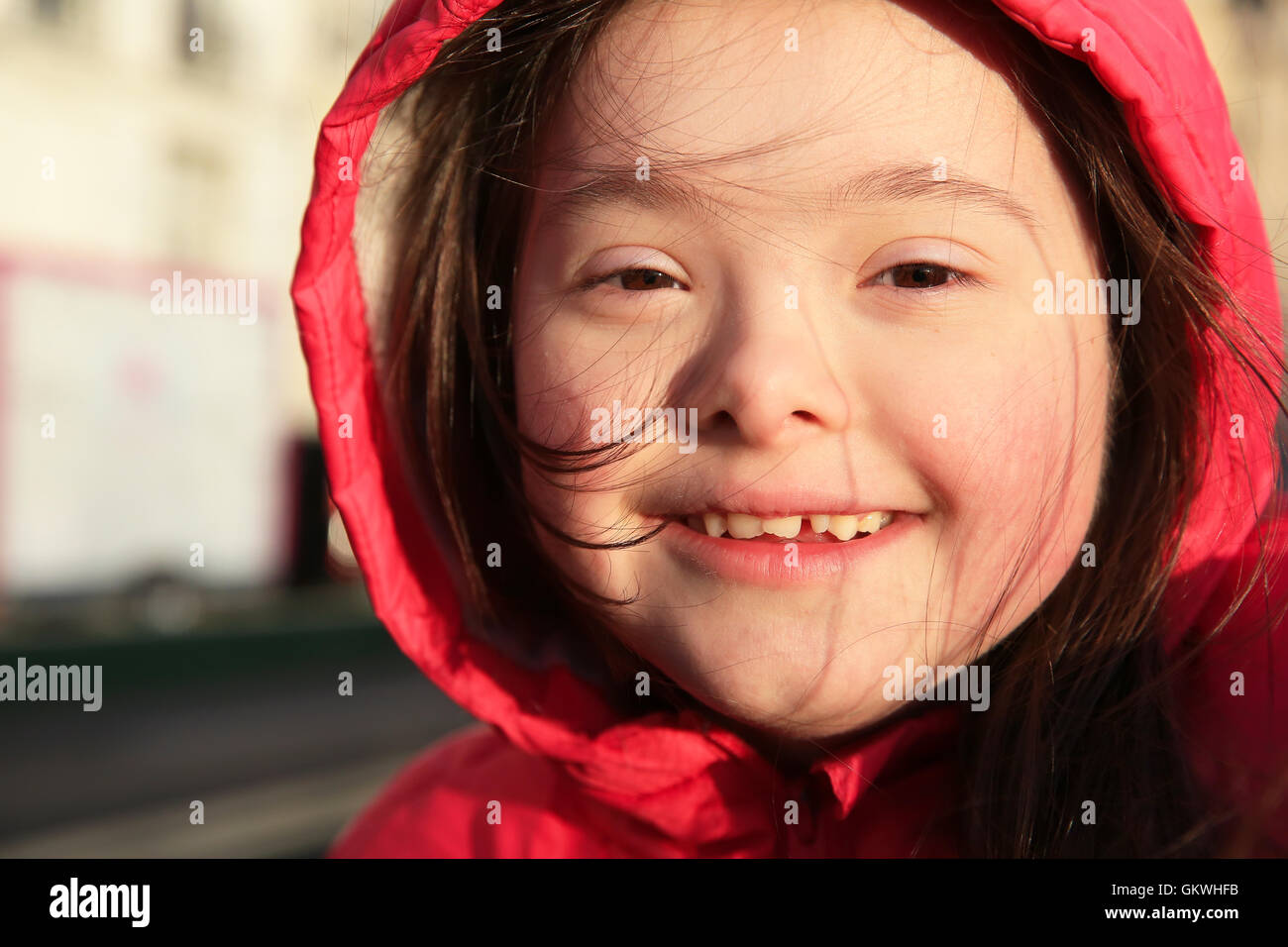 Portrait of little girl smiling outside Stock Photo - Alamy