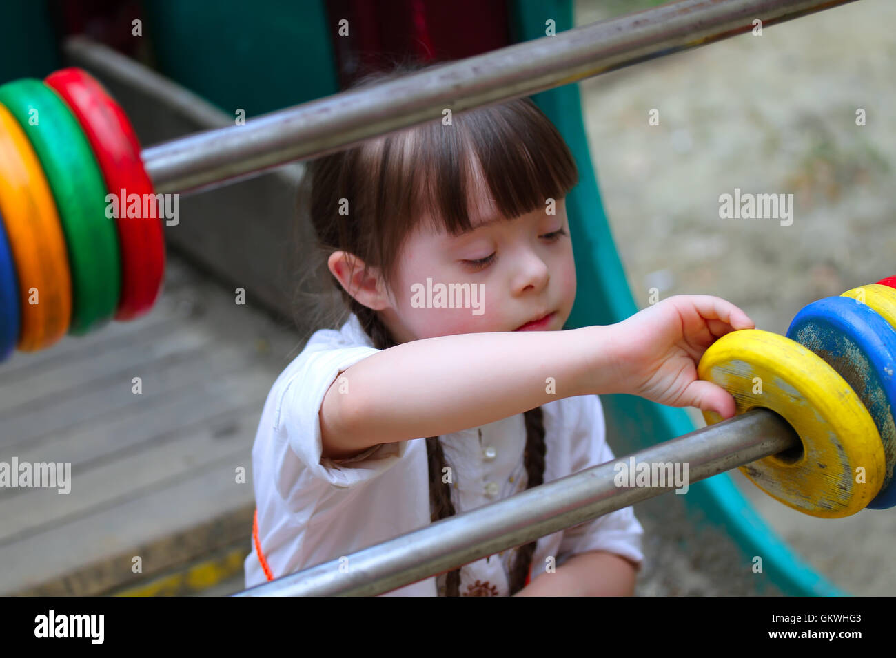 Beautiful little girl on the playground Stock Photo - Alamy