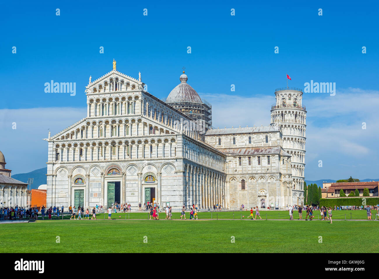 Tourist waiting to visit the Duomo of Pisa in Piazza dei Miracoli square. Tuscany, Italy. Stock Photo