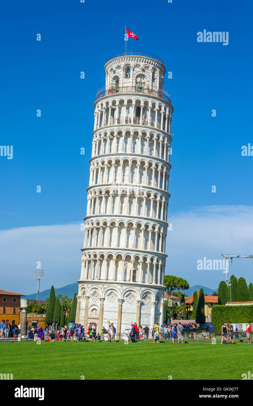 Tourist waiting to visit the Leaning tower in Piazza dei Miracoli square of Pisa. Tuscany, Italy. Stock Photo