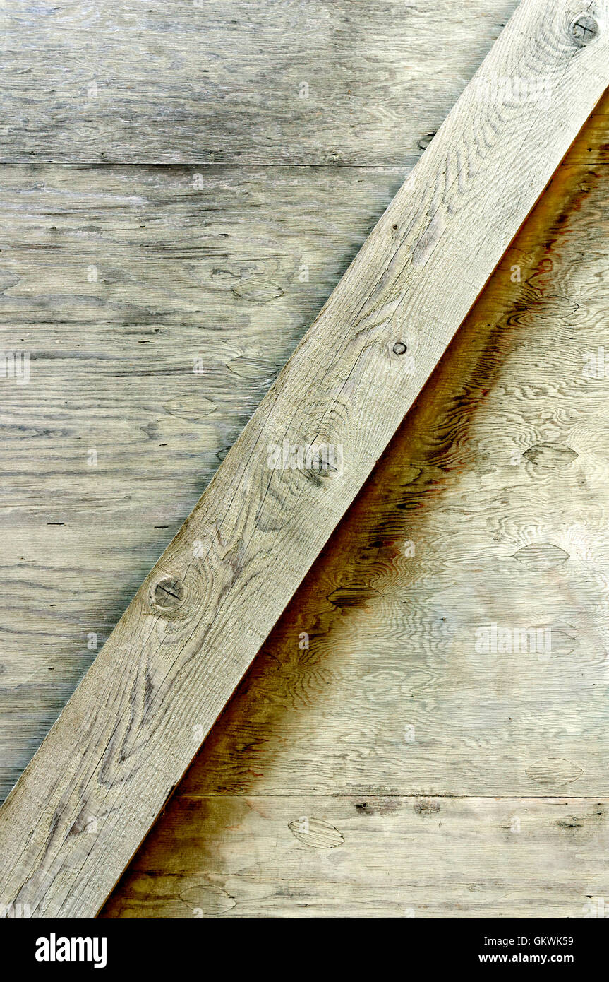 Diagonal support on a wooden wall Stock Photo