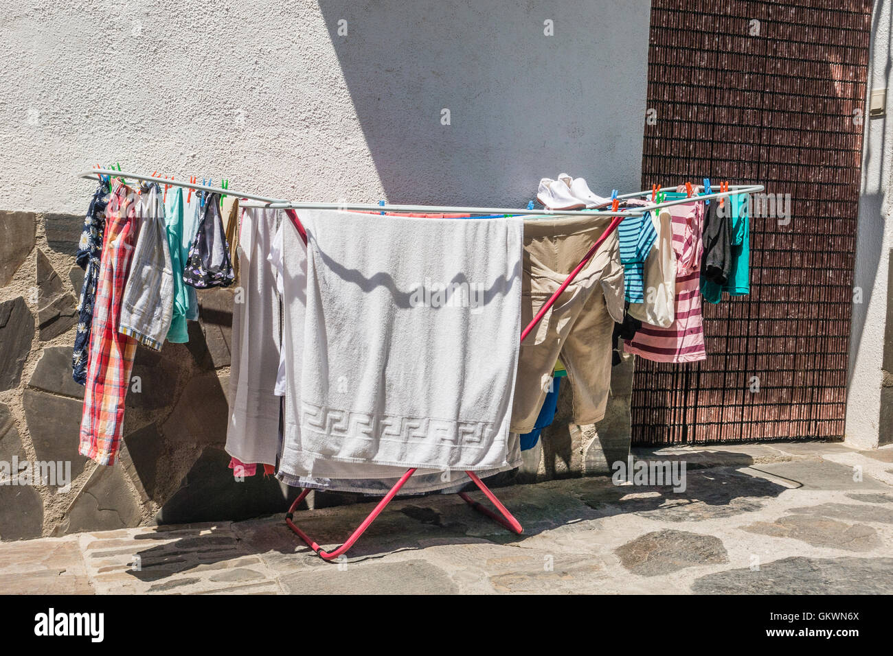 Laundry drying in Capileira, Spain, a white village. Capileira is the  highest and most northerly of three villages nearby Stock Photo - Alamy