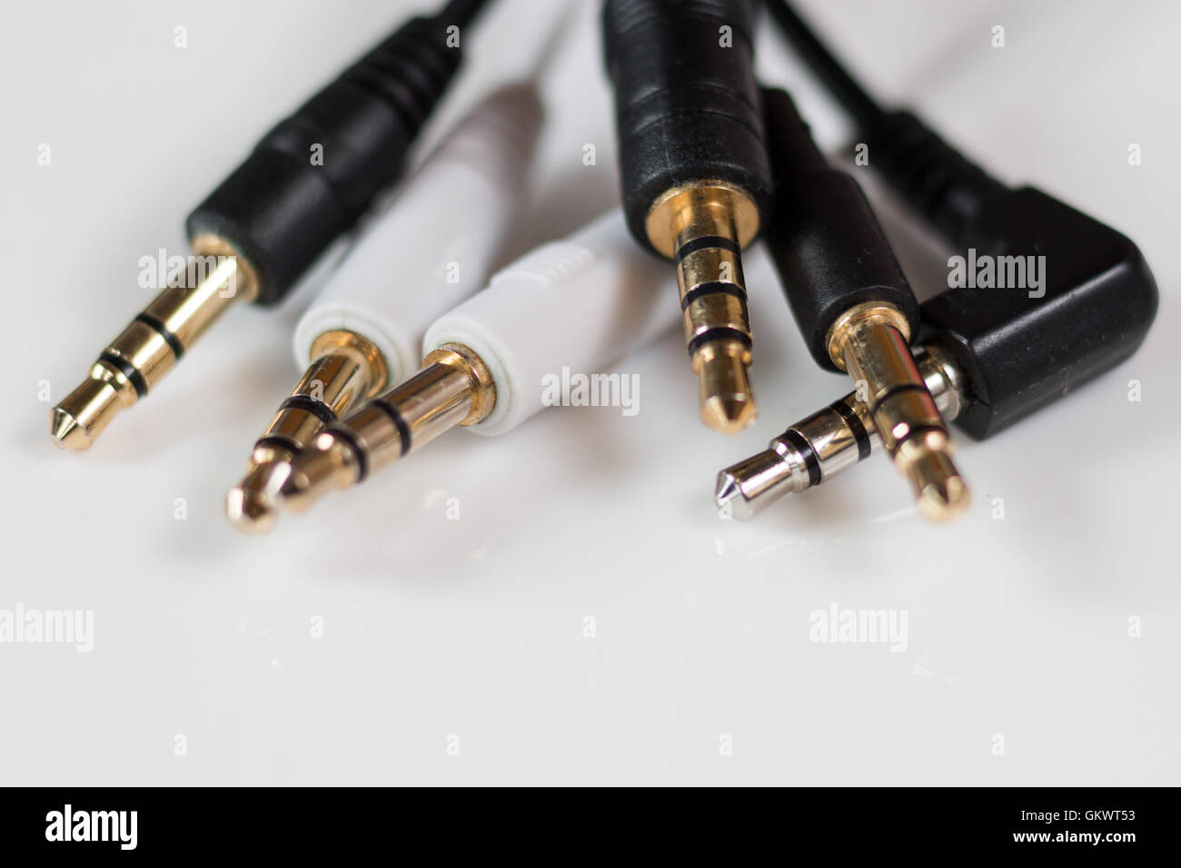 Group of audio leads showing the classic 3.5mm headphone plug Stock Photo