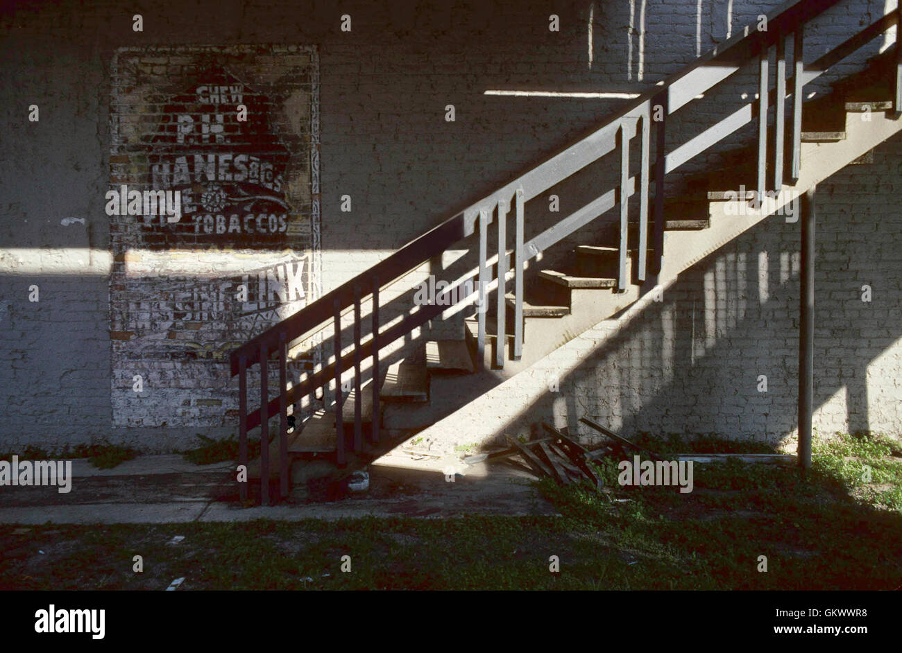 An old staircase and billboard in the rural middle Florida town of Stark lends a feeling of nostalgia. Stock Photo