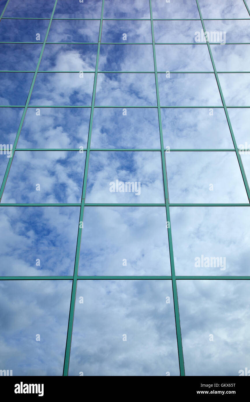 clouds and blue sky reflected in glass facade Stock Photo - Alamy