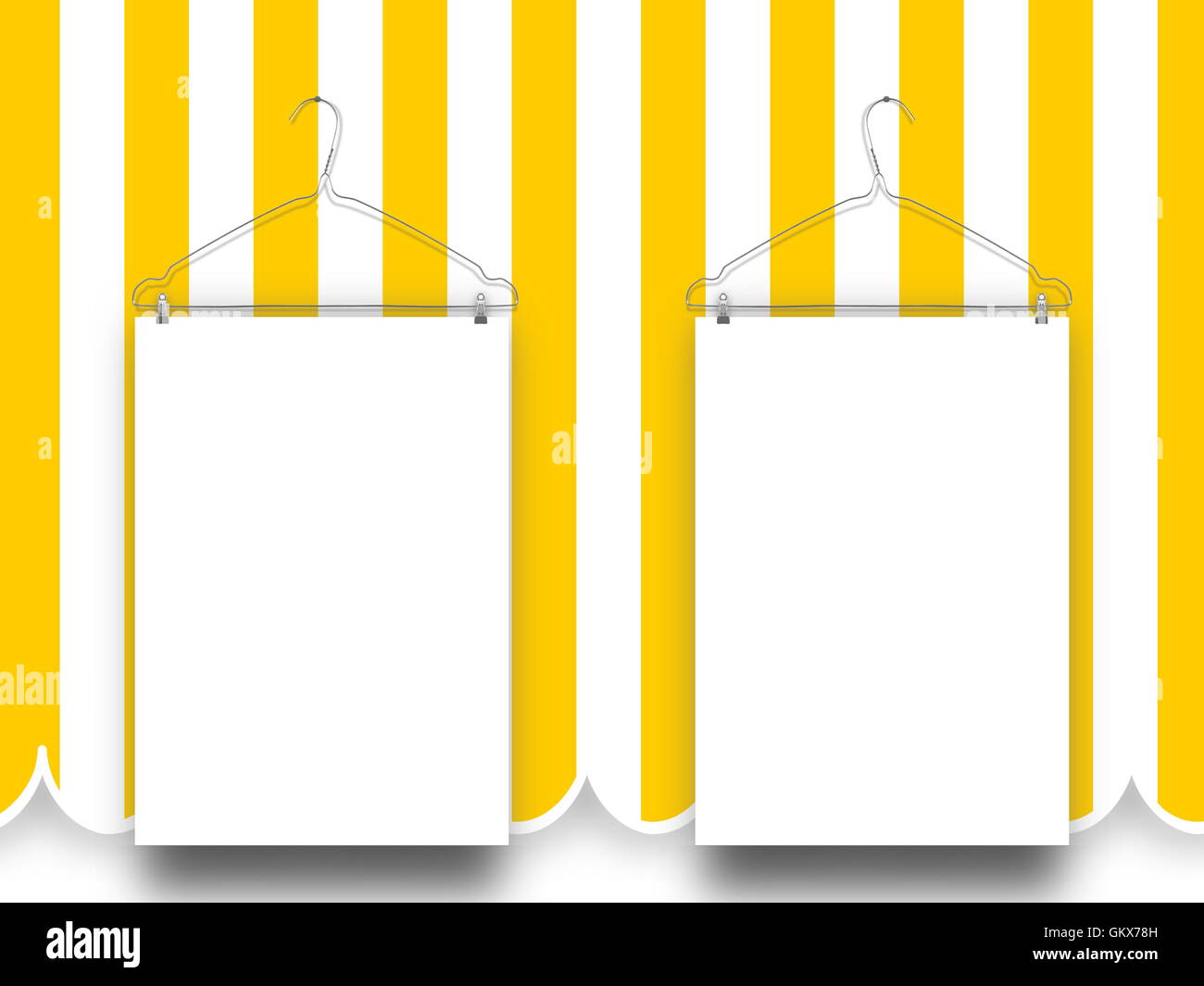 Closeup of two blank frames hanged by clothes hangers against yellow