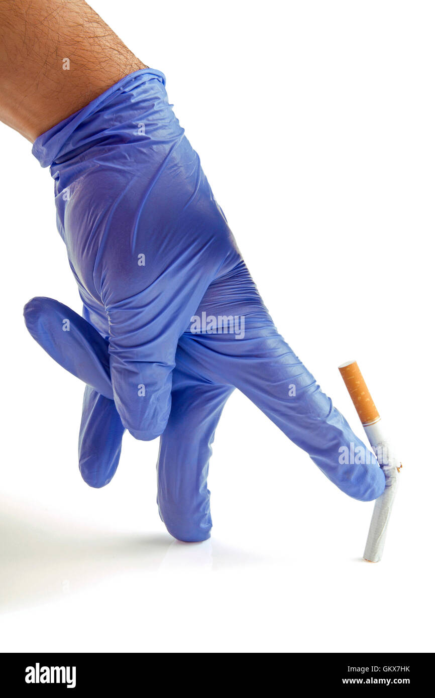 Gloved hand throwing cigarette Quit smoking metaphor Stock Photo Alamy