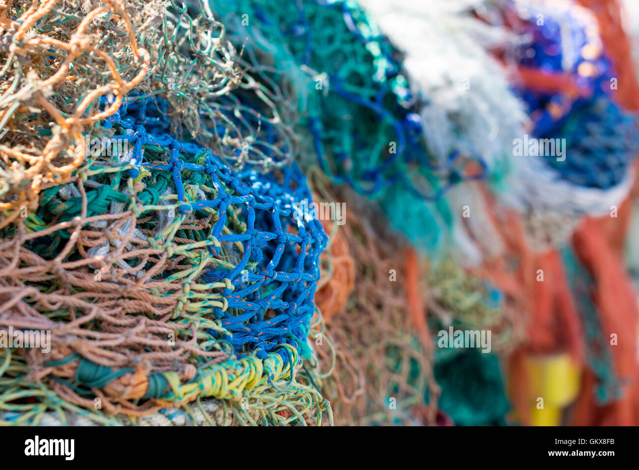 Closeup of a pile of vibrant fishing nets Stock Photo