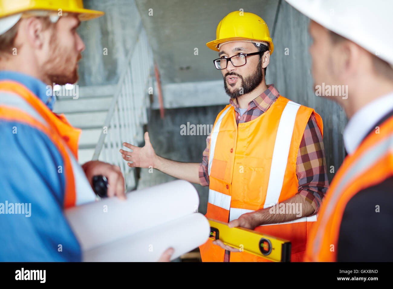 Architect with level tool explaining rules of building Stock Photo Alamy