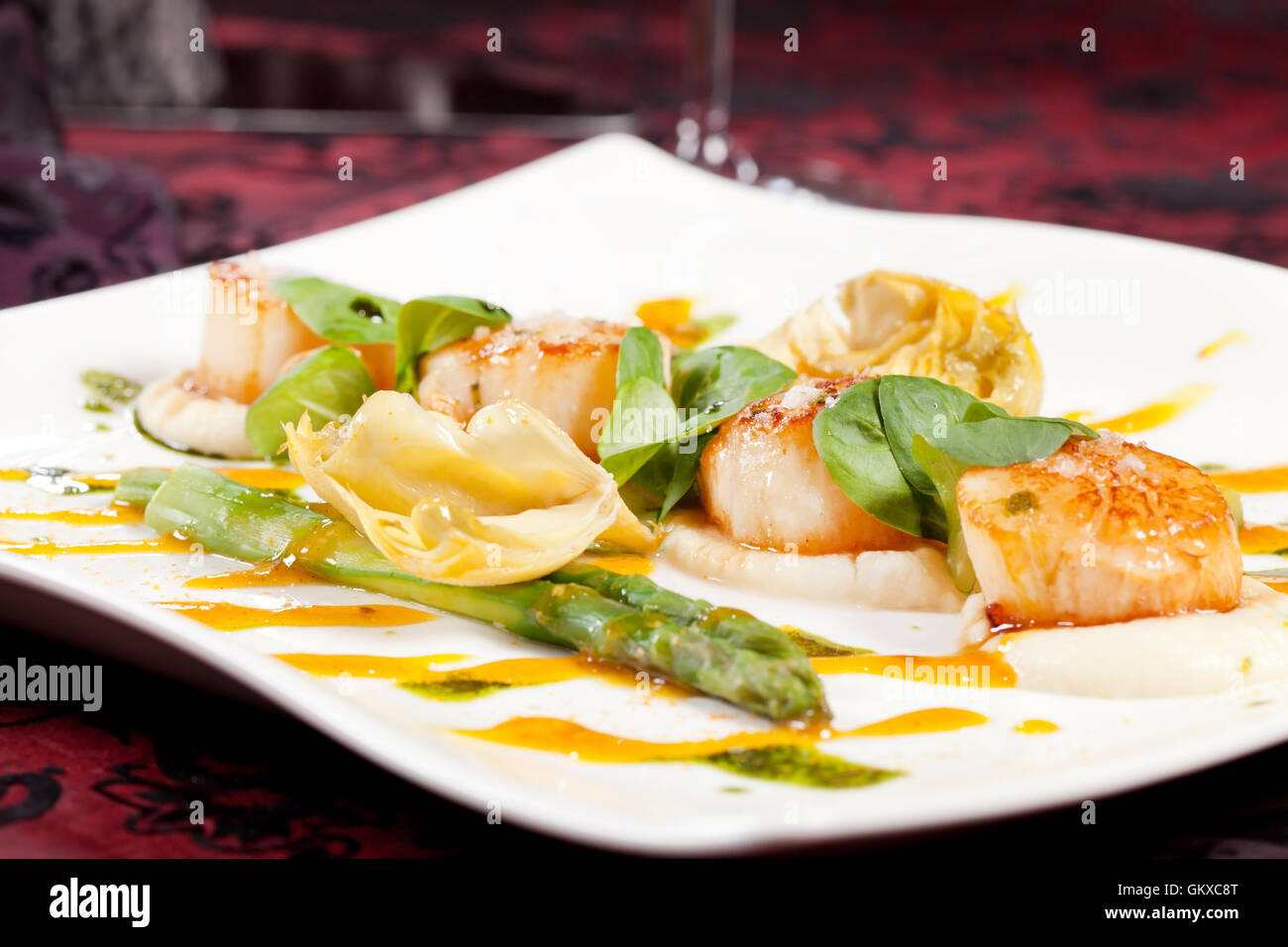 Baked scallops with asparagus Stock Photo Alamy