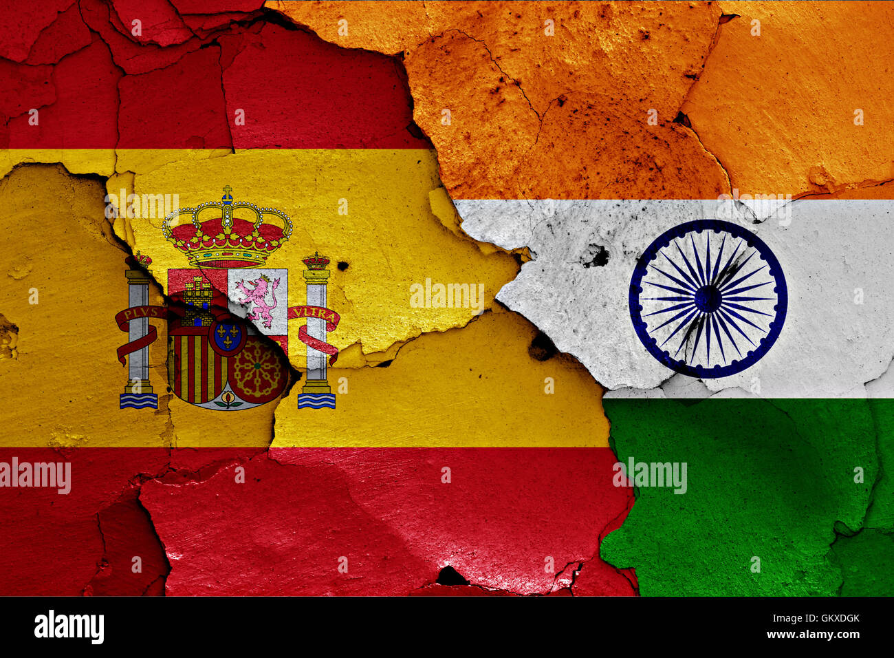 flags of Spain and India painted on cracked wall Stock Photo