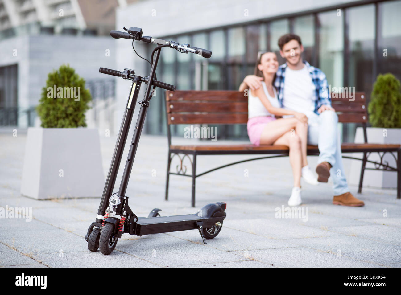 Loving couple sitting on the bench Stock Photo