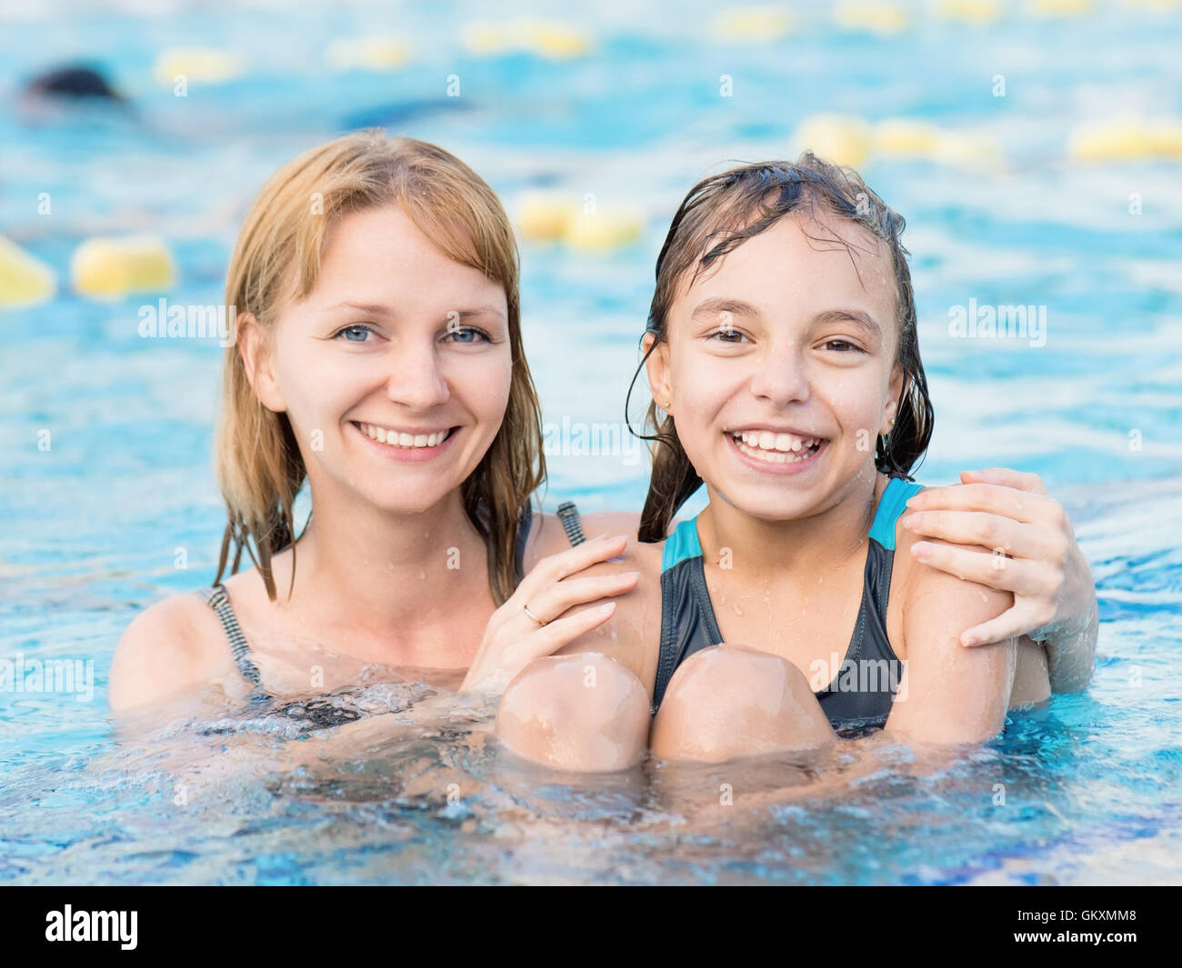 Mother and daughter in pool Stock Photo - Alamy