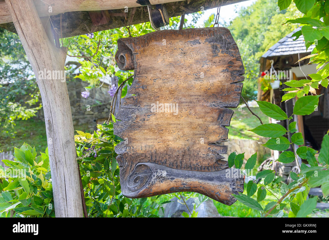 Wooden pointer on the background of beautiful greenery of Stock Photo ...