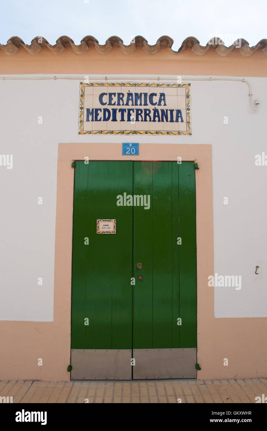 Formentera: the green door of Ceramica Mediterranea, a famous ceramic craft store in Sant Francesc Xavier Stock Photo