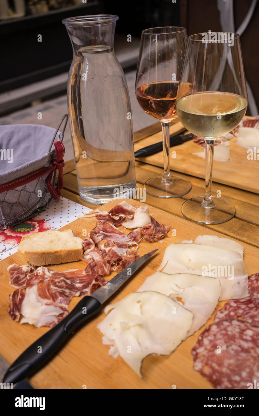 Charcuterie and cheese lunch with wine. Stock Photo