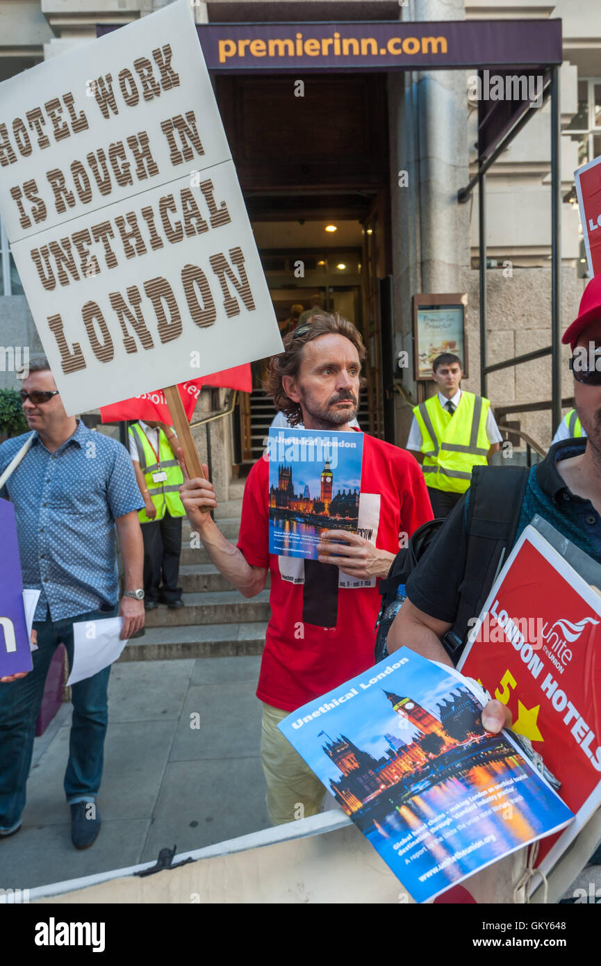 London, UK. August 23rd 2016. Unite Hospitality Workers launch their 'Unethical London' report into the bullying, harassment and victimisation of workers in London's top hotels, where management deny the right to join unions and bargain for better wages and conditions with a protest outside the Premier Inn at London County Hall. Two thirds of hospitality workers earn less than the London Living Wage. Peter Marshall/Alamy Live News Stock Photo