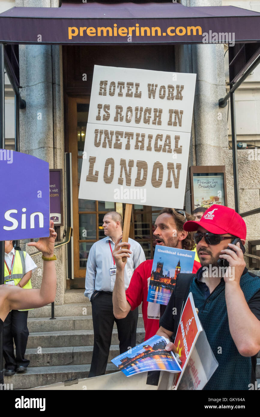 London, UK. August 23rd 2016. Unite Hospitality Workers launch their 'Unethical London' report into the bullying, harassment and victimisation of workers in London's top hotels, where management deny the right to join unions and bargain for better wages and conditions with a protest outside the Premier Inn at London County Hall. Two thirds of hospitality workers earn less than the London Living Wage. Peter Marshall/Alamy Live News Stock Photo