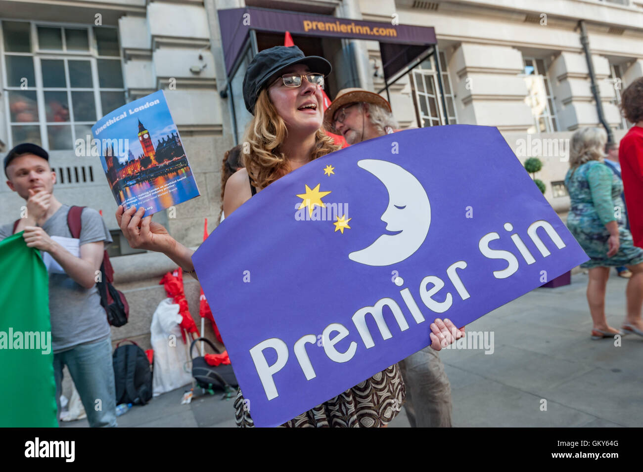 London, UK. August 23rd 2016. Unite Hospitality Workers launch their 'Unethical London' report into the bullying, harassment and victimisation of workers in London's top hotels, where management deny the right to join unions and bargain for better wages and conditions with a protest outside the Premier Inn at London County Hall. Two thirds of hospitality workers earn less than the London Living Wage. Peter Marshall/Alamy Live News Stock Photo