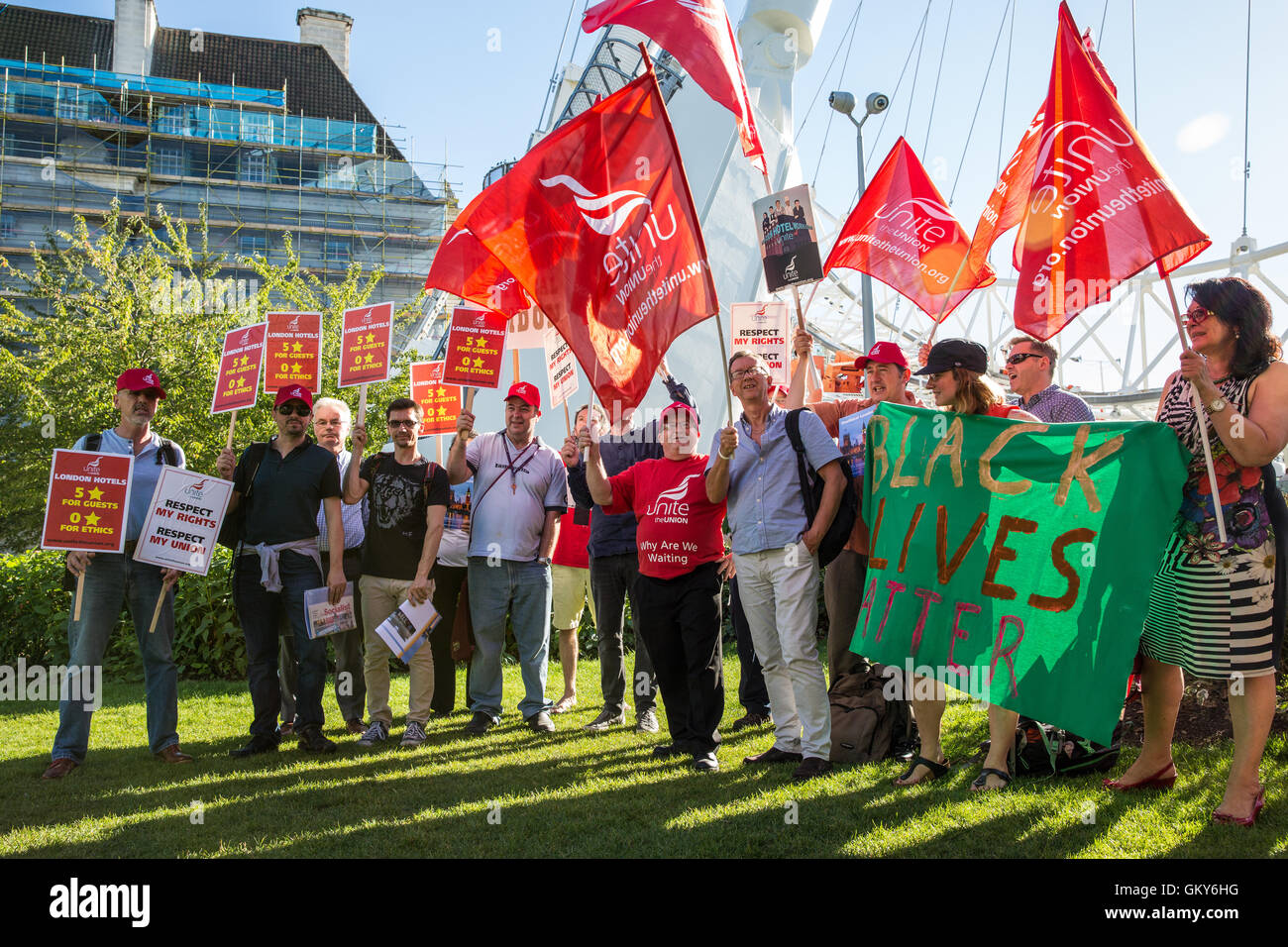 London, UK. 23rd August, 2016. Members of the Unite Hotel Workers Branch prepare to launch the Unethical London report, which details the manner in which workers at leading London hotels are denied access to the basic human rights of freedom of association and collective bargaining, close to the London Eye. Two-thirds of hospitality workers earn less than the London Living Wage. Credit:  Mark Kerrison/Alamy Live News Stock Photo
