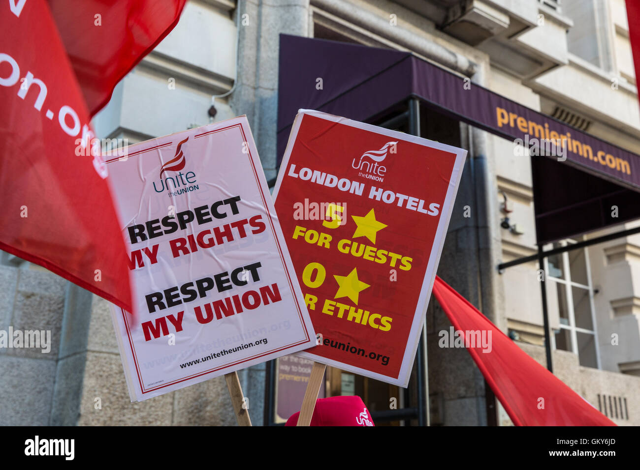 London, UK. 23rd August, 2016. Placards held by members of the Unite Hotel Workers Branch launching the Unethical London report, which details the manner in which workers at leading London hotels are denied access to the basic human rights of freedom of association and collective bargaining, at a protest outside the Premier Inn at County Hall. Two-thirds of hospitality workers earn less than the London Living Wage. Credit:  Mark Kerrison/Alamy Live News Stock Photo