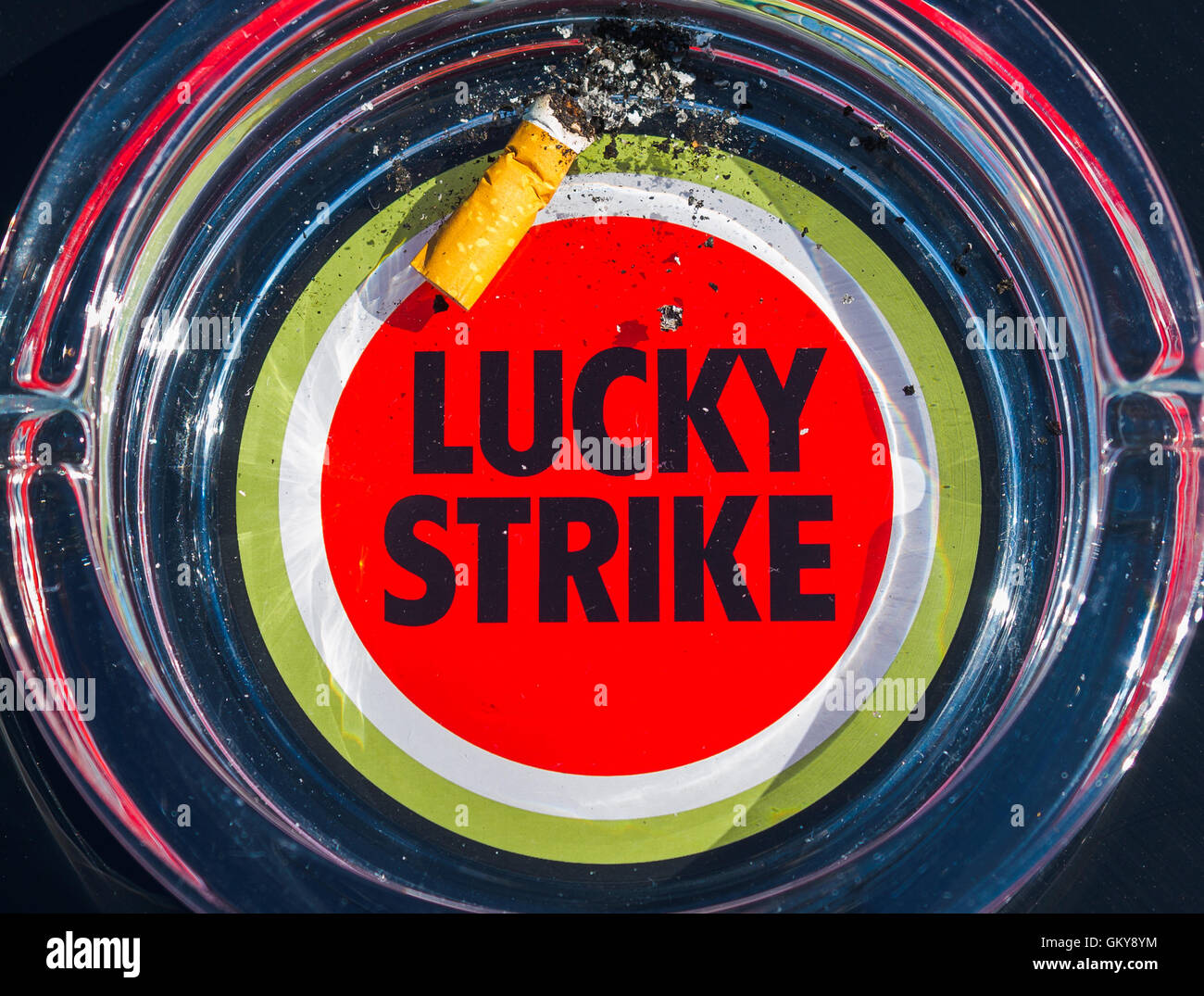 Bayreuth, Germany. 24th Aug, 2016. An ash tray with the Lucky Strike logo on it can be seen in Bayreuth, Germany, 24 August 2016. The tobacco company British American Tobacco (BAT) plans to cut 950 positions due to heavy sales losses at Bayreuth. Photo: NICOLAS ARMER/dpa/Alamy Live News Stock Photo