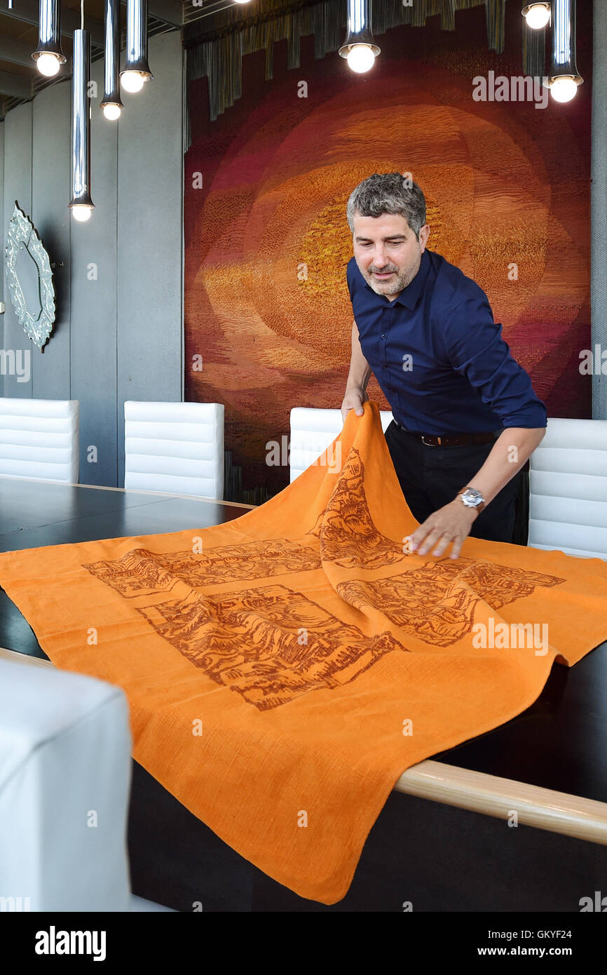 Liberec, Czech Republic. 25th Aug, 2016. Interior of Jested mountain hotel and television tower by famous Czechoslovak architect Karel Hubacek, in Liberec, Czech Republic, August 25, 2016. Petr Smaus shows the original tablecloth from year 1973 during the press conference. © Radek Petrasek/CTK Photo/Alamy Live News Stock Photo