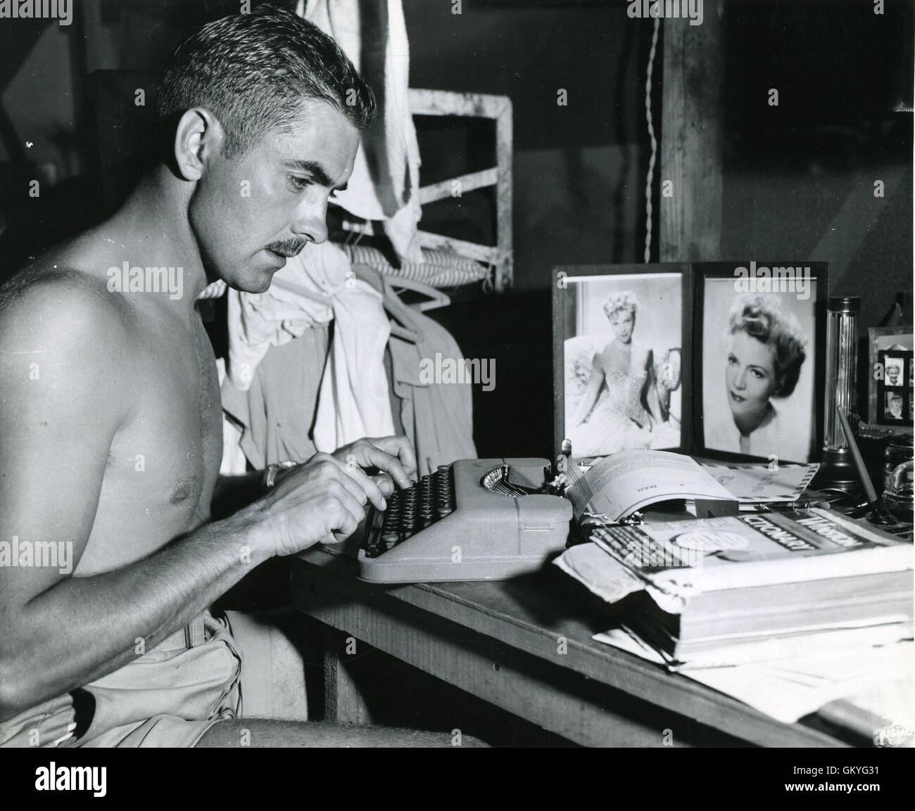 U.S. Marine 1st Lt. Tyrone Power is shown writing to his wife, Annabella, from a Marine base on Saipan, central Pacific island, when Power was serving as a transport pilot with a Marine Air Wing. Stock Photo