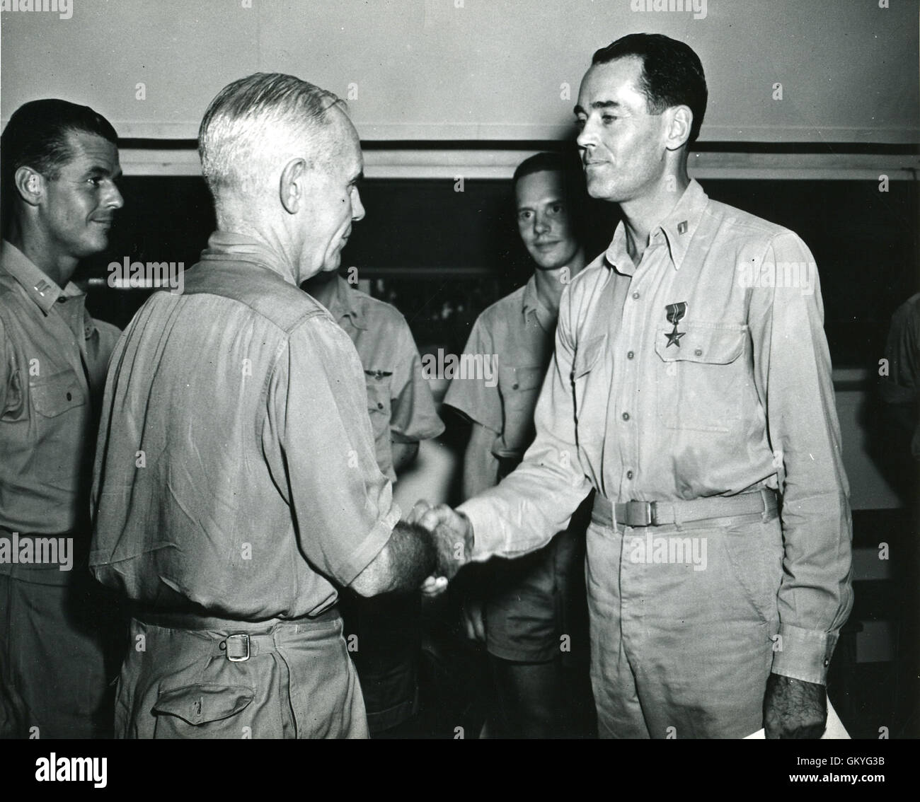 Lt. Henry Fonda is presented with a Bronze Star Medal for meritorious service as an Assistant Operations Officer and Air Combat Intelligence Officer during World War II. Stock Photo