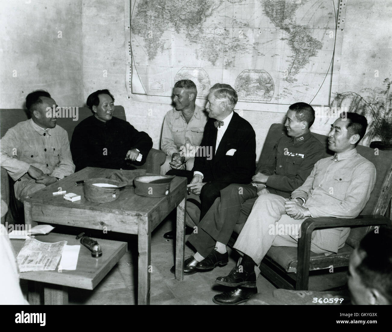 Conference at Yenan Communist Headquarters before Mao Tze Tung, chairman, left for Chungking meeting. Central figures are U.S. Ambassador Patrick J. Hurley, Col. I.V. Yeaton, U.S. Army observer, and Mao Tze Tung. Stock Photo