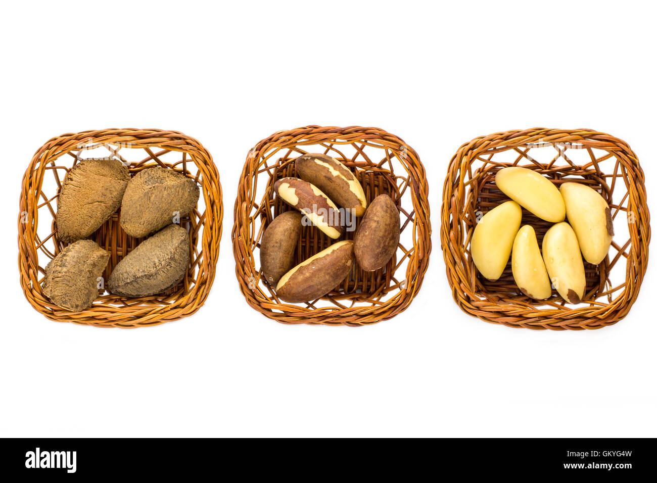 Three baskets with Brazil Nuts. One is with shell, second with it