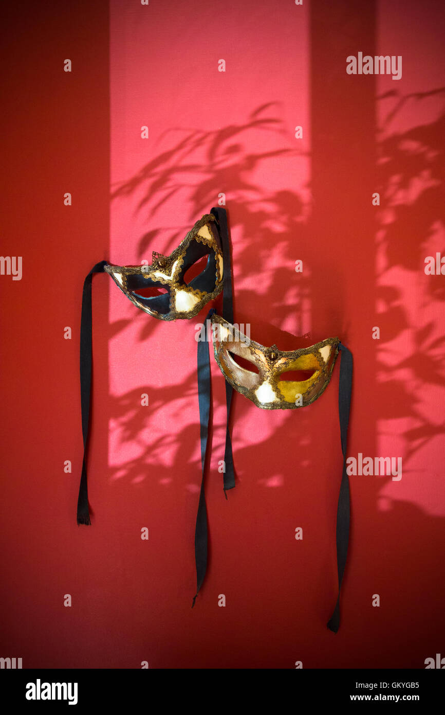 Traditional mask hanging on tree hires stock photography and images