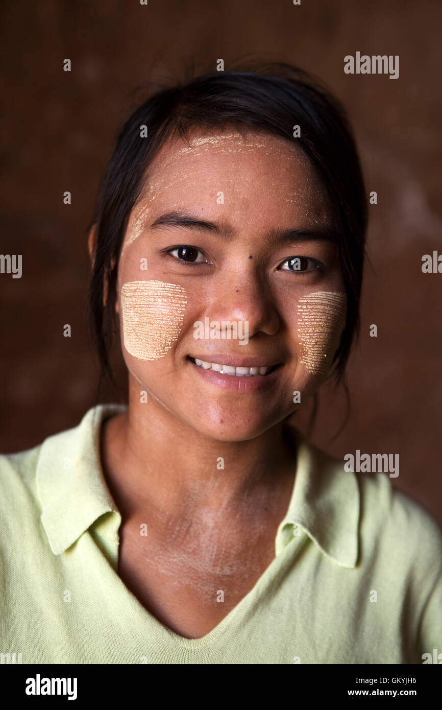 A Burmese woman at a temple in Bagan, Myanmar (Burma). She wears