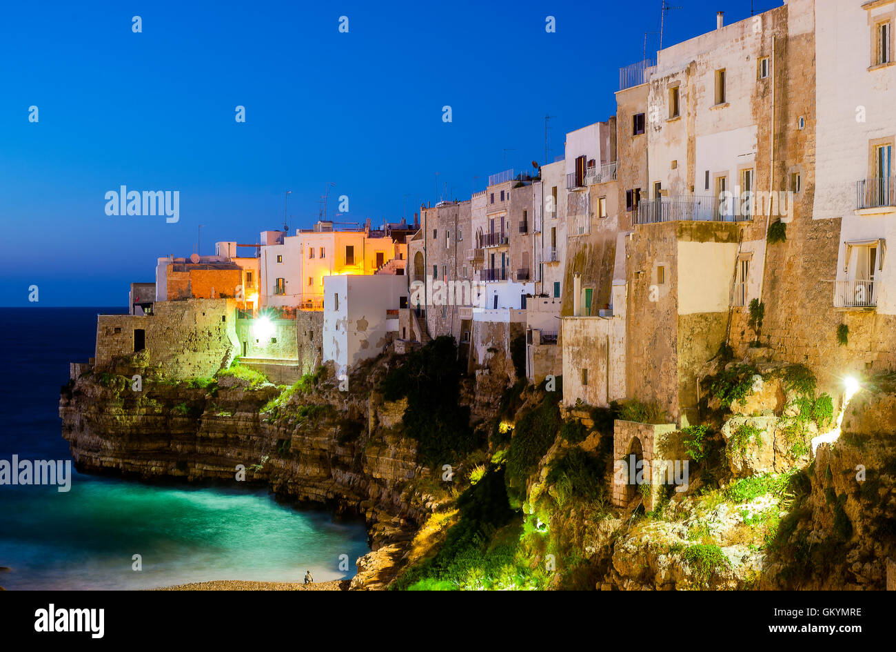 Polignano a Mare at night. Sea and rocks. The old town above the sea Stock Photo