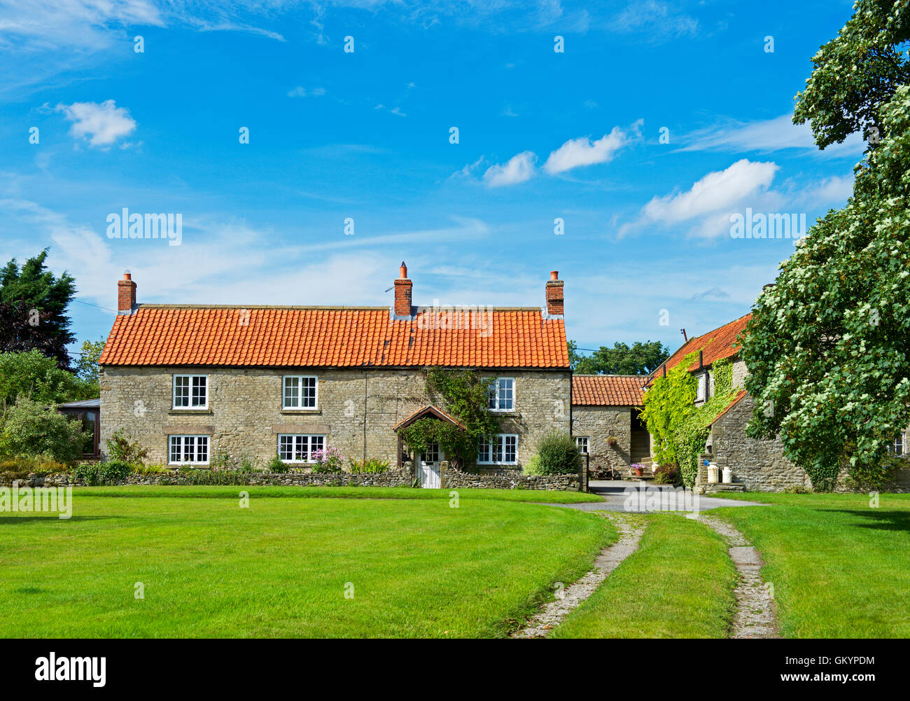 House and village green, Fadmoor, North Yorkshire, England UK Stock
