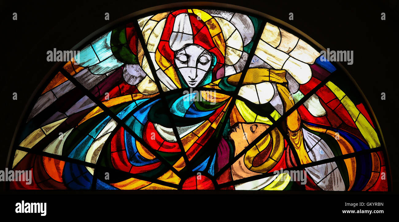 Stained Glass depicting the Apparition of Virgin Mary before the shepherd children at the Sanctuary of Fatima in Portugal. Stock Photo