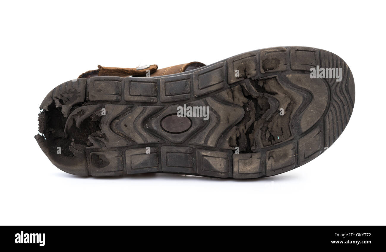 bottom of a badly worn out sandal on white Stock Photo