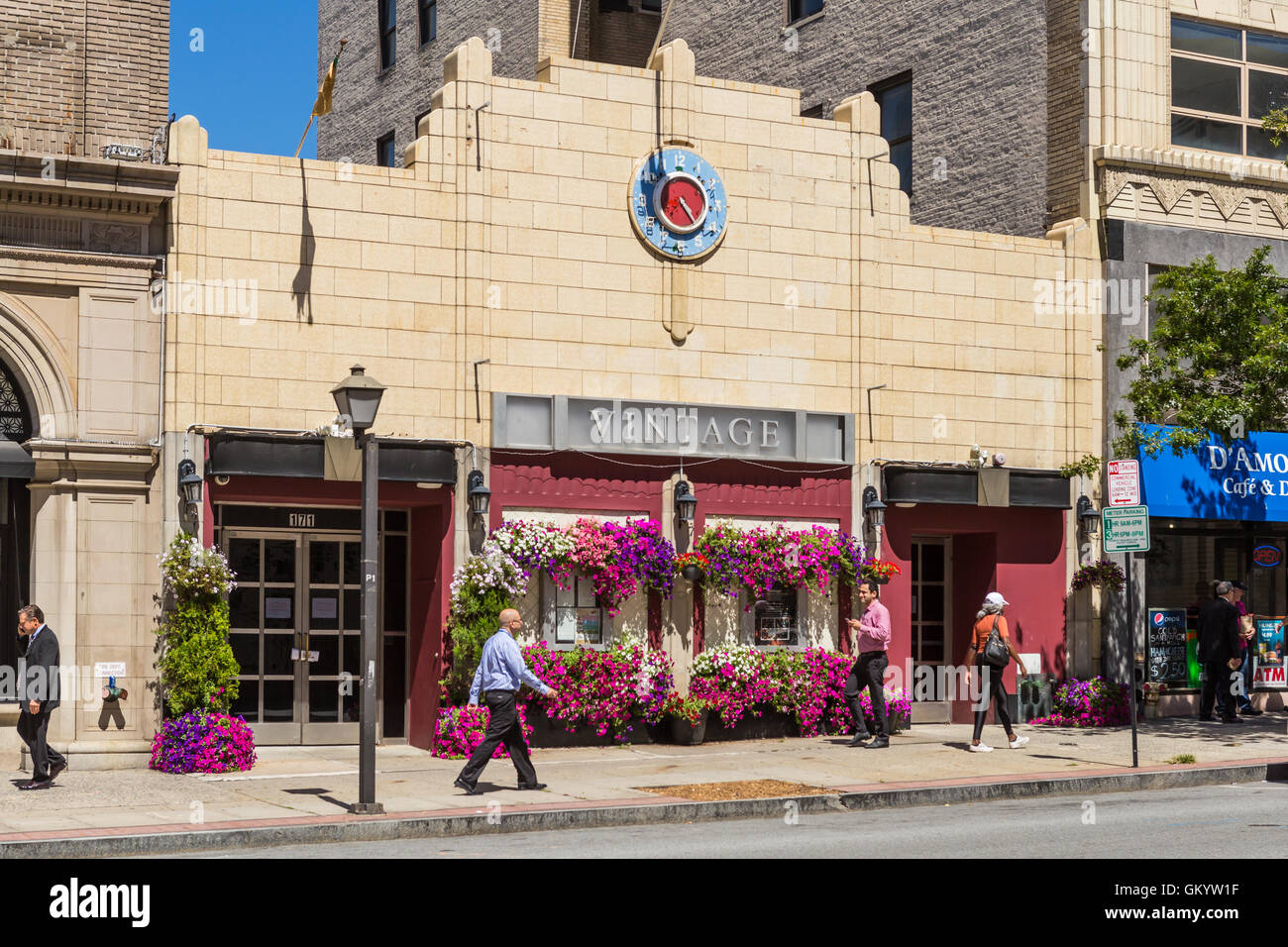 Pedestrians walk past the Vintage Lounge in downtown White Plains, New