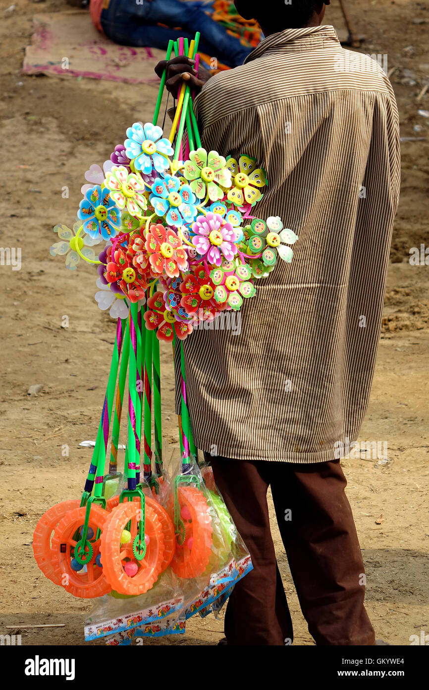A local boy selling toys in Market Stock Photo