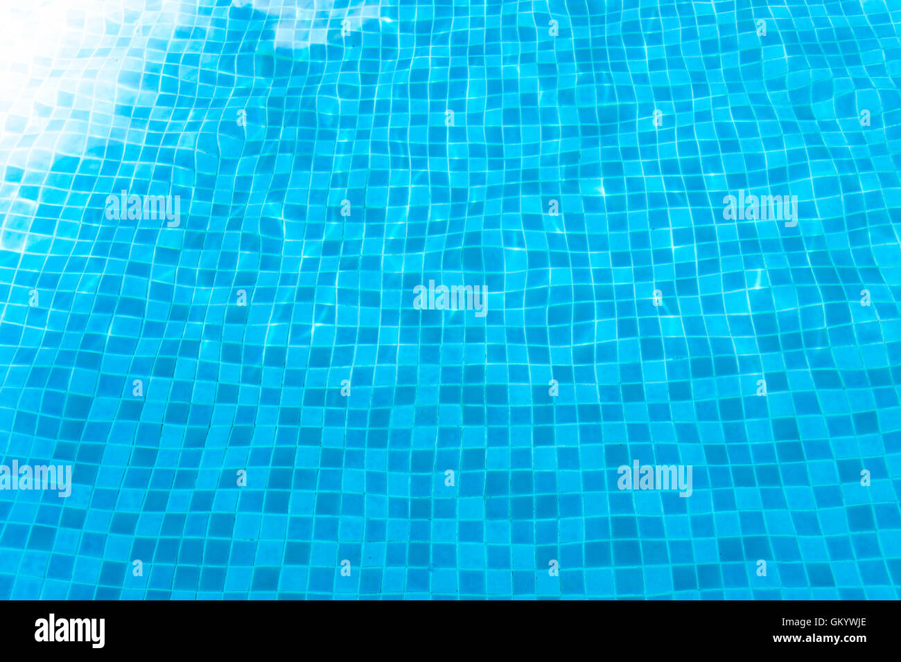 Blue tiled swimming pool background. View from eye Stock Photo - Alamy