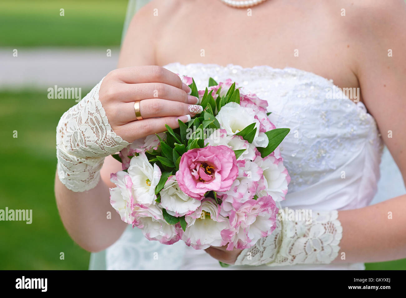 bride hands holding beautiful wedding bouquet Stock Photo