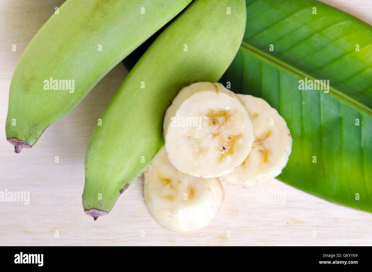 Banana (Other names are Musa banana acuminata, Musa balbisiana, and Musa x paradisiaca) fruit with leaf Stock Photo