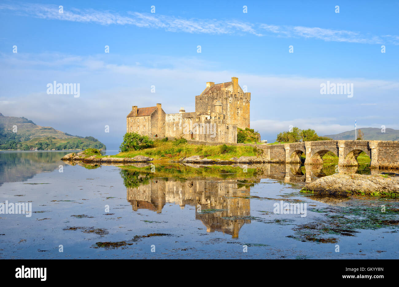 The castle at Eilean Donan reflected in the high tide on Loch Alsh Stock Photo